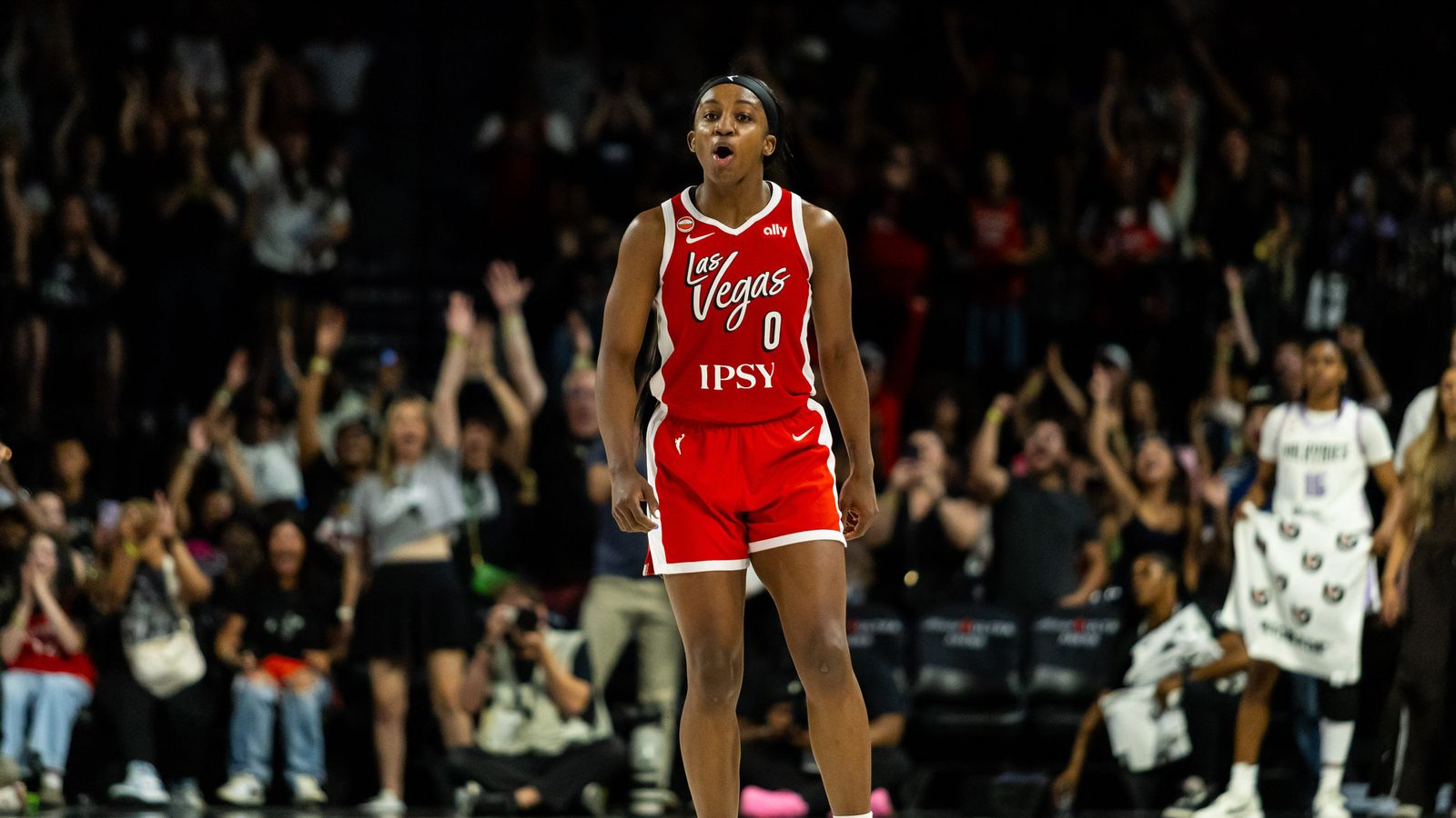 Jackie Young celebrates a three-point shot