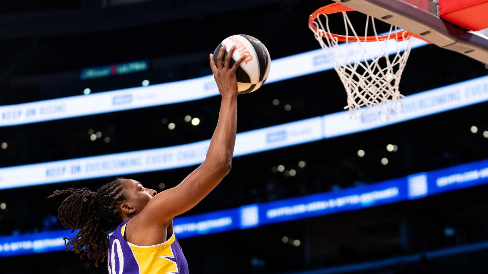 Nneka Ogwumike drives the lane in the WNBA game against Portland Fire.