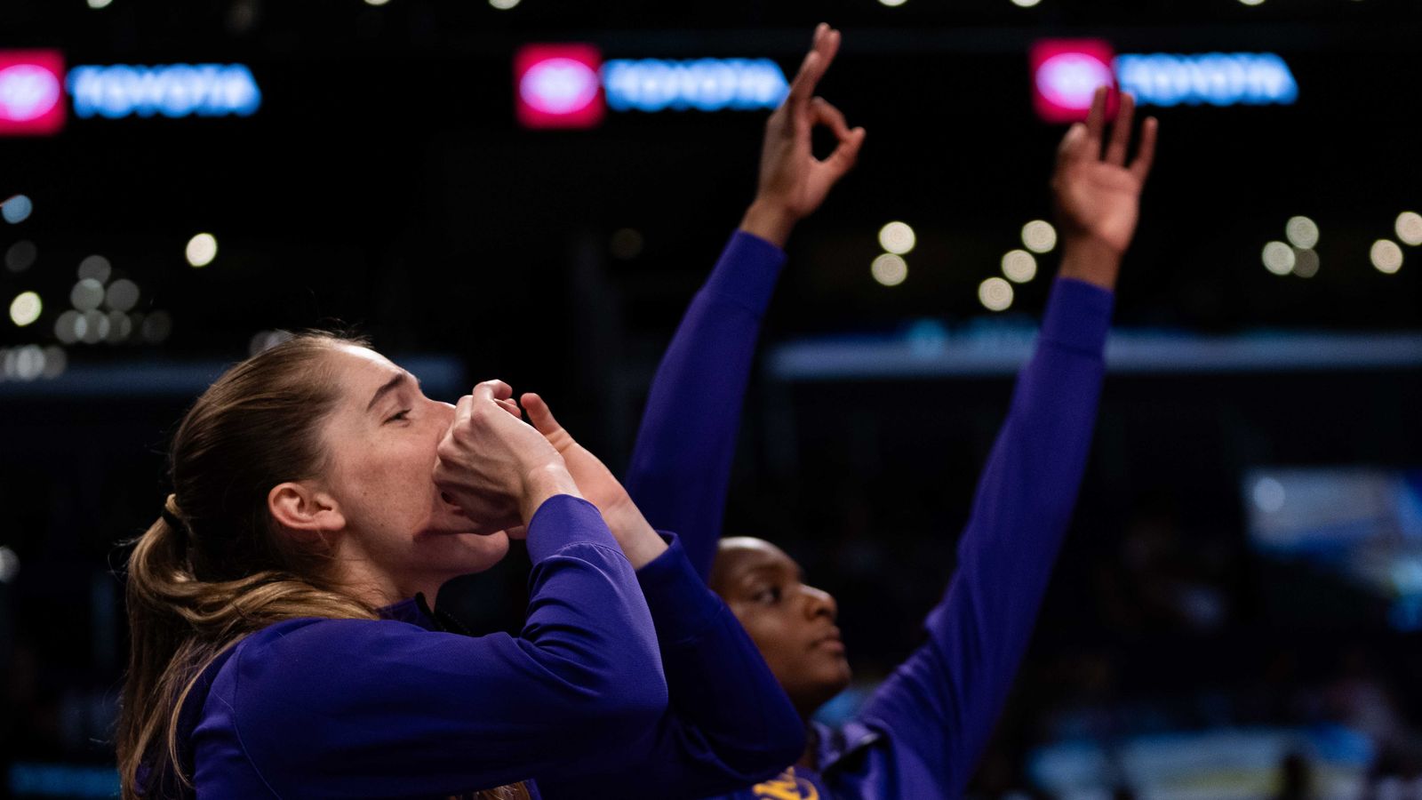 LA Sparks celebrate a three-pointer against Portland Fire.