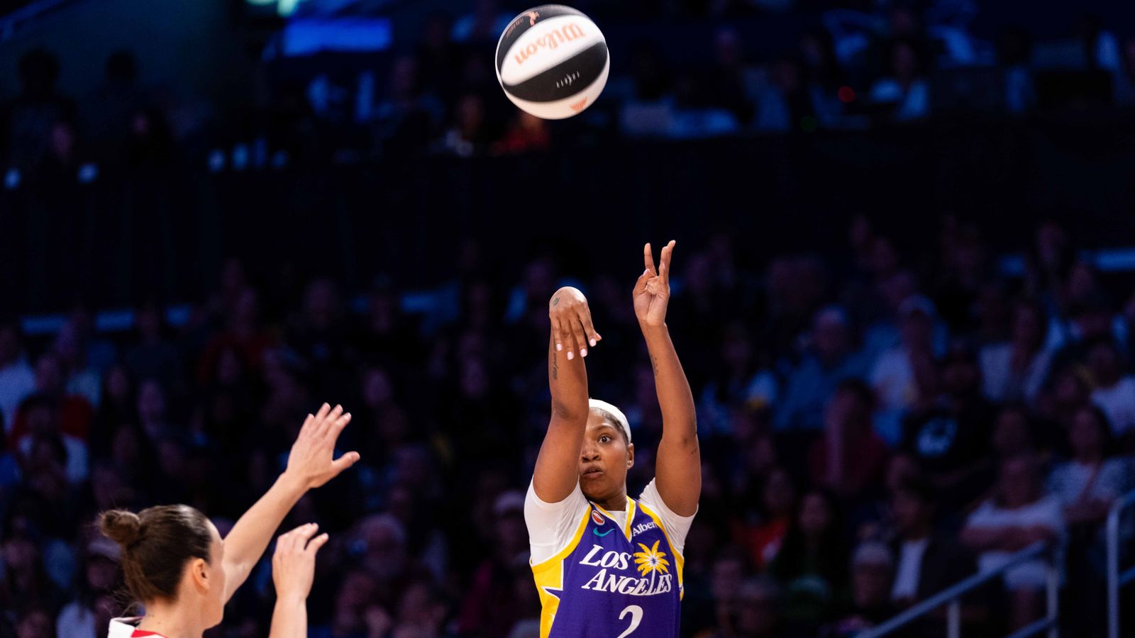 Chance Gray shoots a three-pointer against Portland Fire.