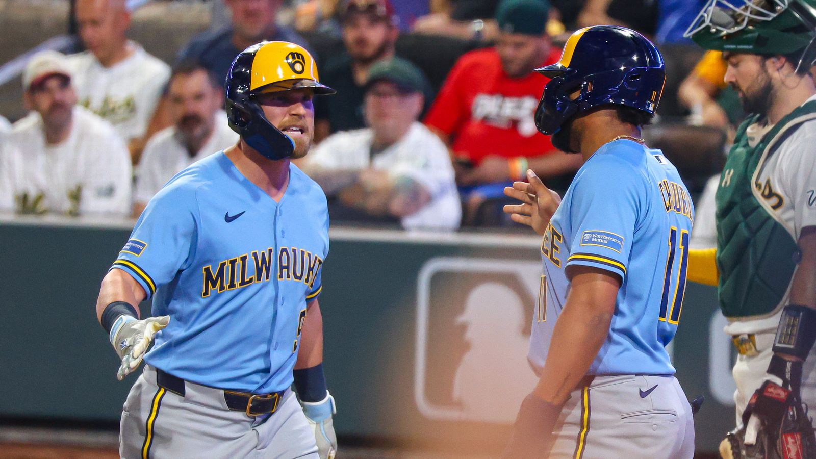 Jake Bauers celebrates with Jackson Chourio after a home run.