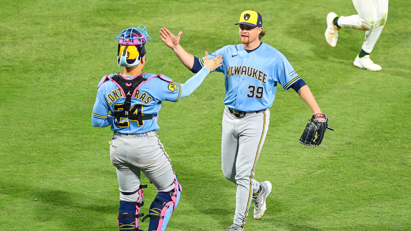 Brewers' Contrearas and Patrick celebrate after a thrilling win.