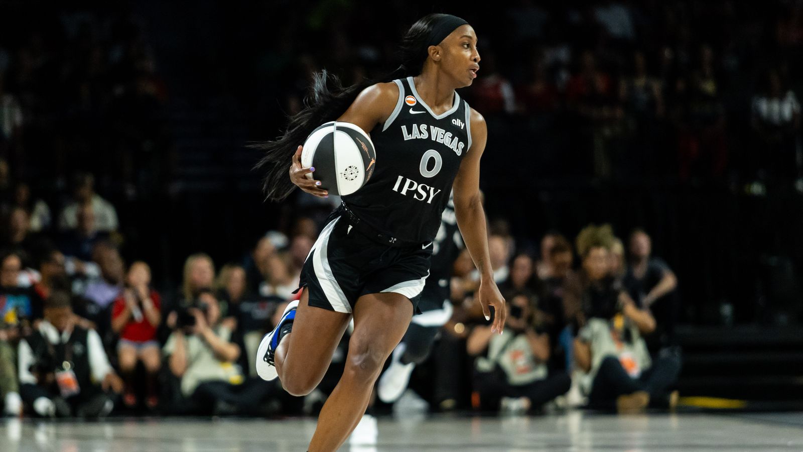 Jackie Young dribbles upcourt in WNBA game, Las Vegas vs. Seattle