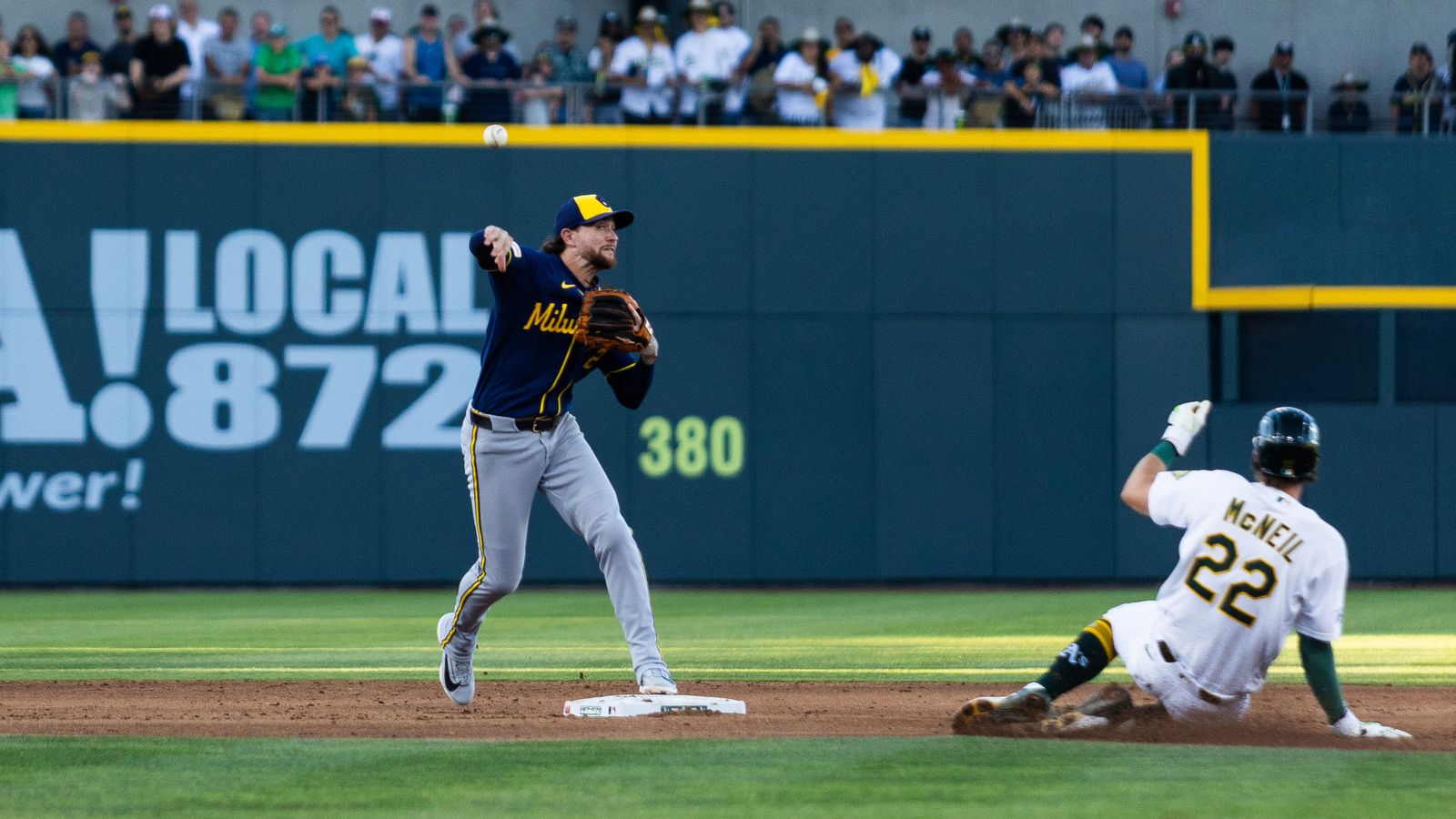 Bryce Turang makes a throw to first base in MLB game