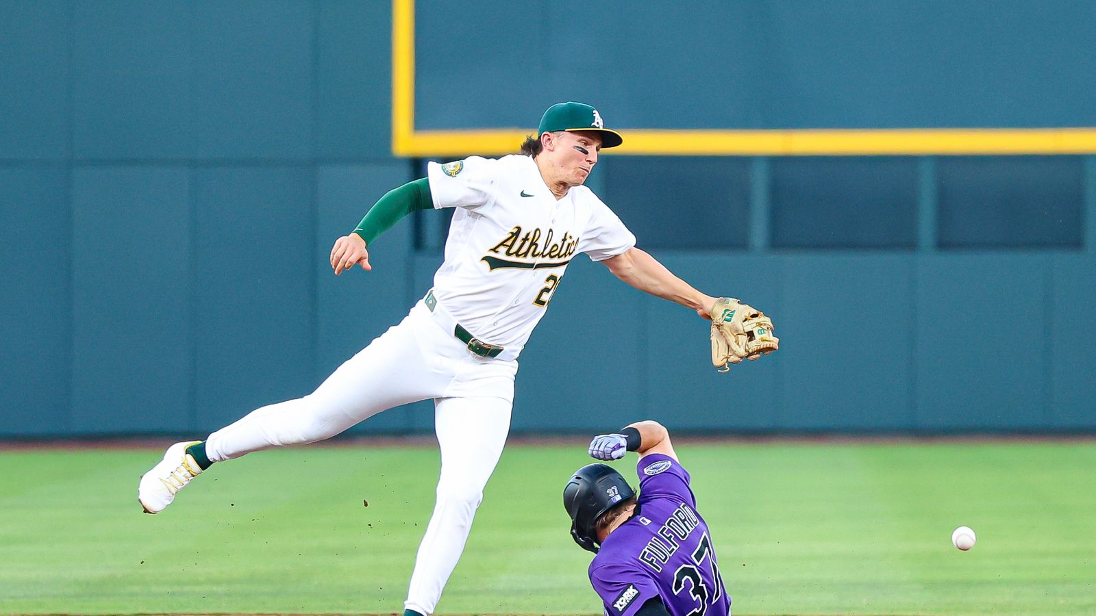 Braxton Fulford slides safely under Zack Gelof after stealing base