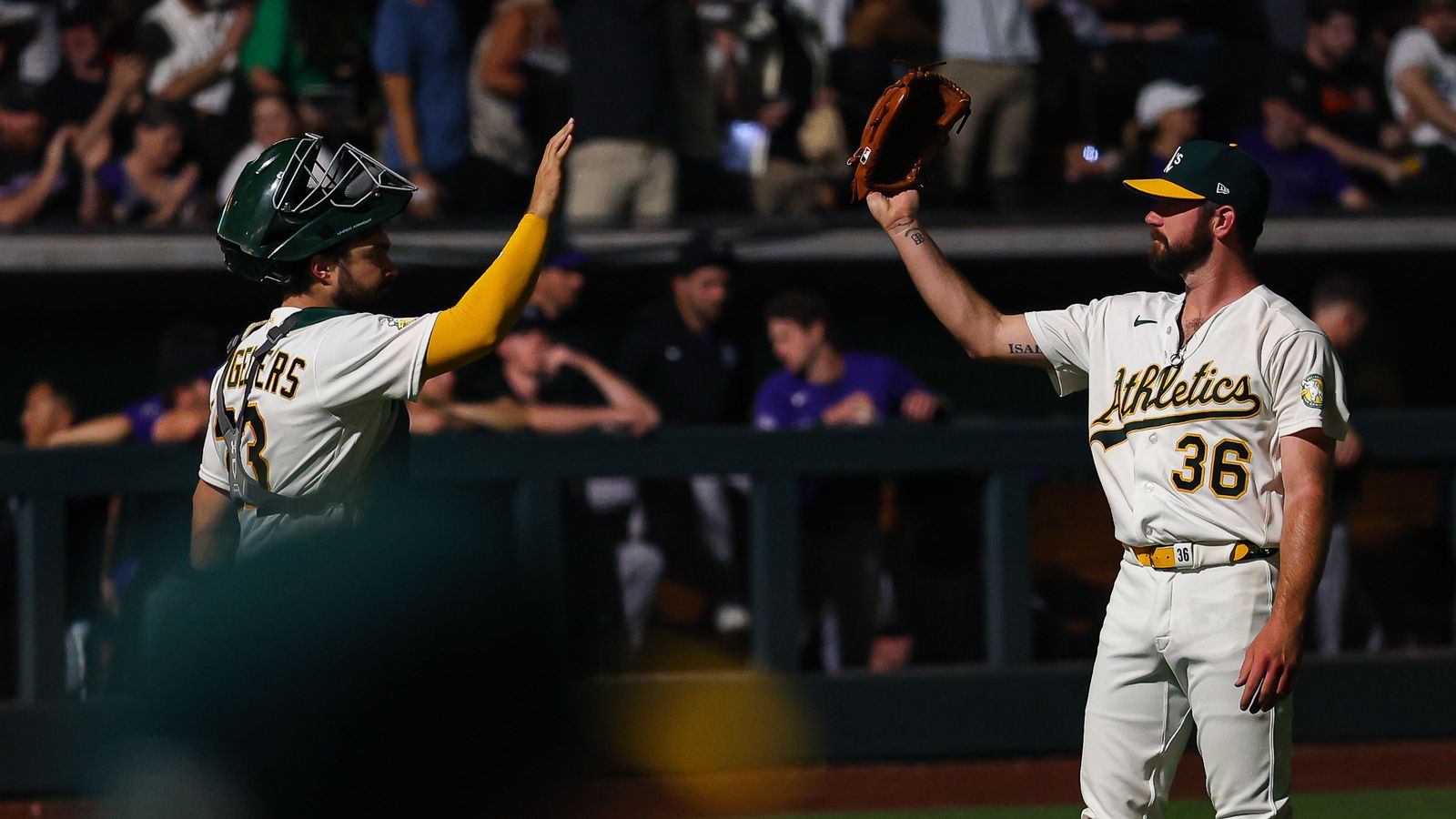 Langeliers and Harris celebrate Athletics' victory over Rockies
