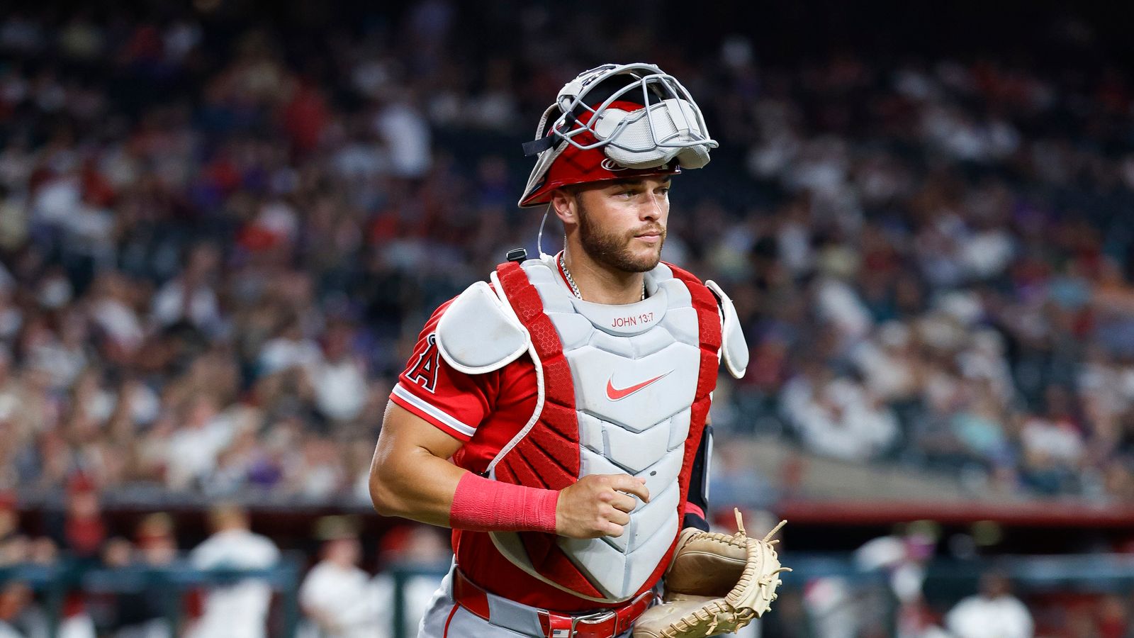 Logan O'Hoppe jogs to the dugout at Chase Field