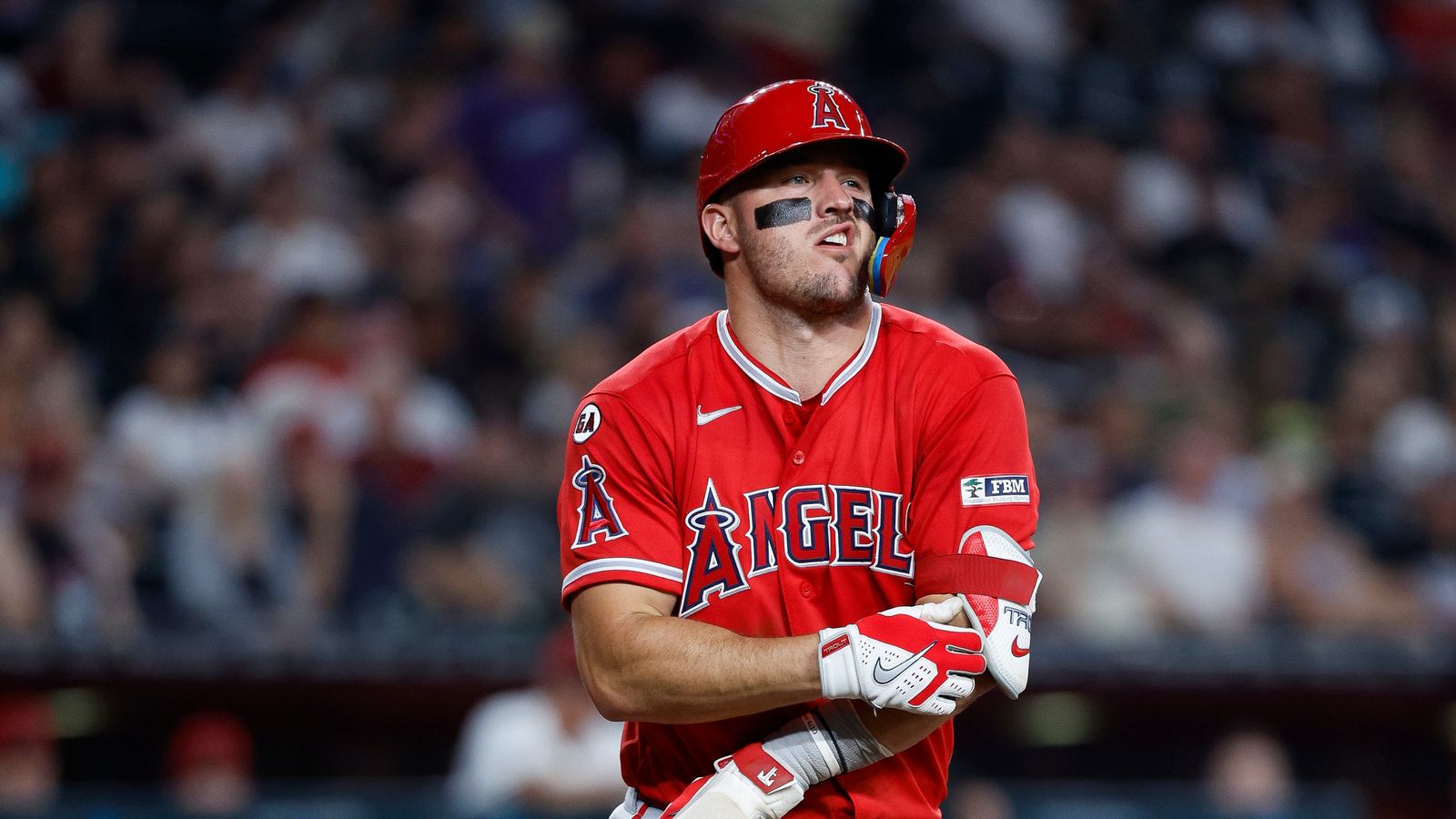 Mike Trout reacts to being hit by a pitch at Chase Field