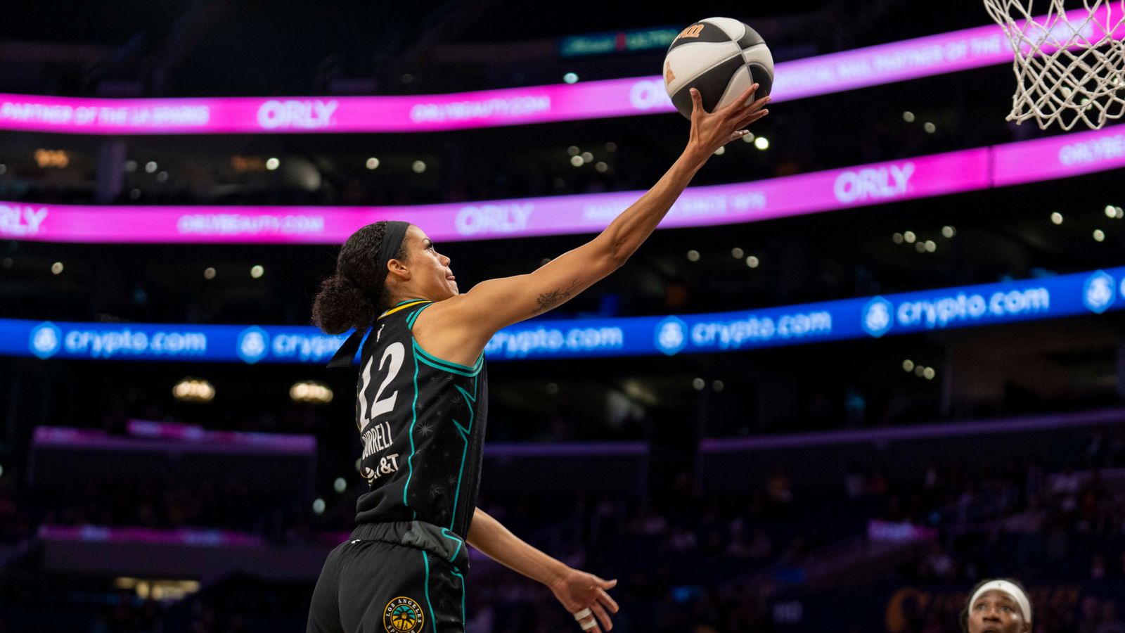 Rae Burrell scores a layup for the Sparks against the Lynx