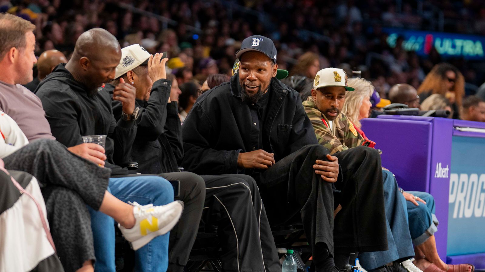 Kevin Durant watches the Sparks vs Lynx WNBA game