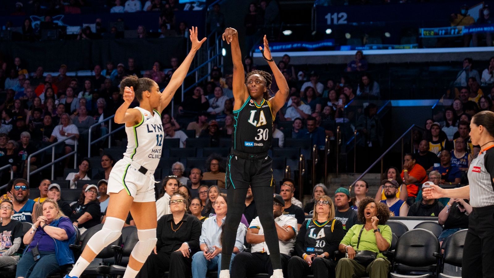 Nneka Ogwumike shoots a three-pointer against the Lynx