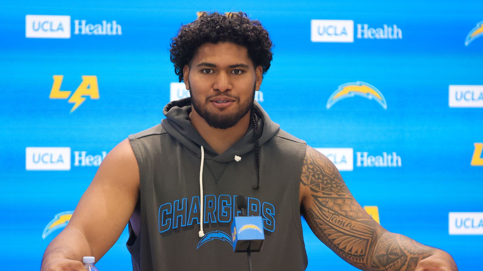 Tuli Tuipulotu speaks before Chargers mini camp session