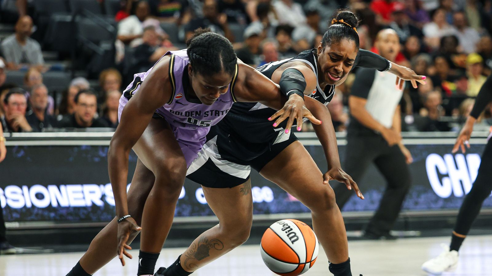 Nadia Fingall forces a turnover from Cheyenne Parker-Tyus.