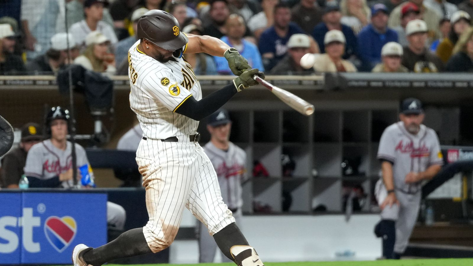 Xander Bogaerts makes contact during the Padres-Braves game