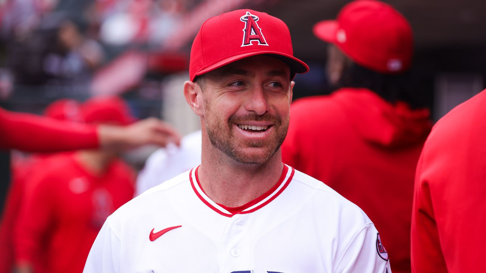 Donovan Walton smiles in the dugout during the Angels vs. Orioles game