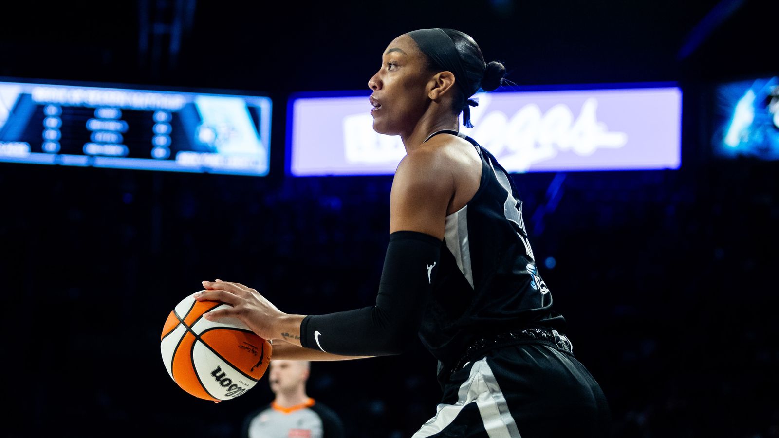 A'ja Wilson prepares to shoot in a tight WNBA game.