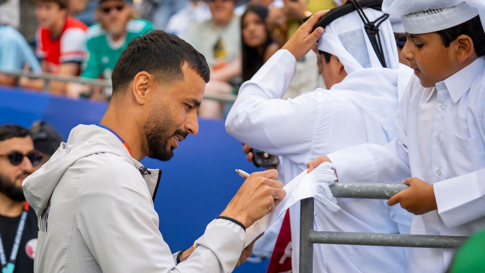 Boualem Khoukhi greets fans before the FIFA World Cup match in Seattle.