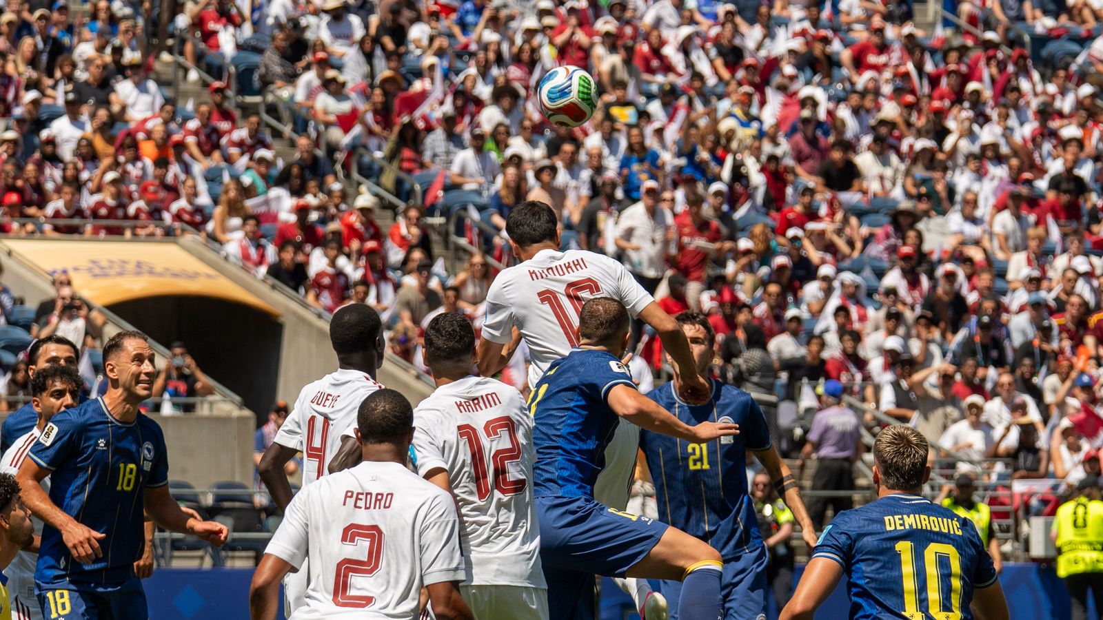 Boualem Khoukhi wins a header at the FIFA World Cup, Seattle 2026.