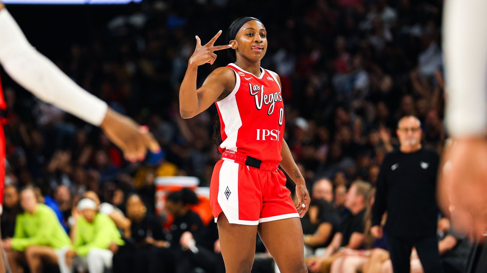 Jackie Young celebrates a three-pointer for the Aces against the Wings.