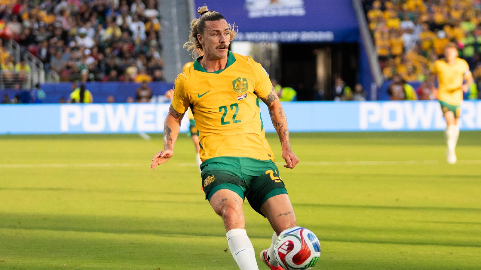 Jackson Irvine searching for a pass in the World Cup 2026