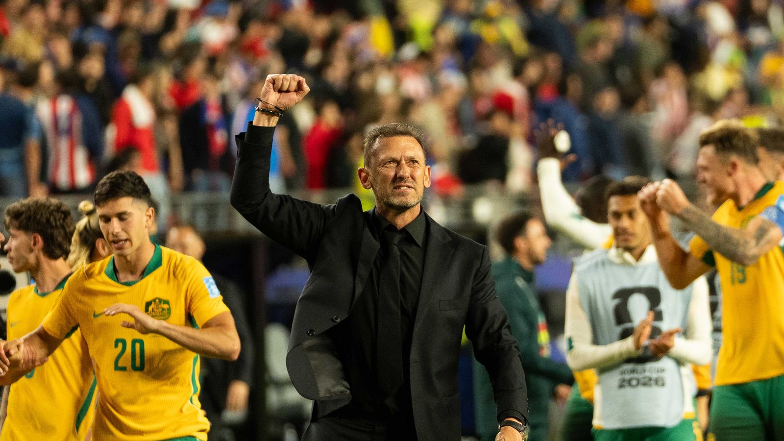 Coach Tony Popovic celebrates with fans at the FIFA World Cup 2026