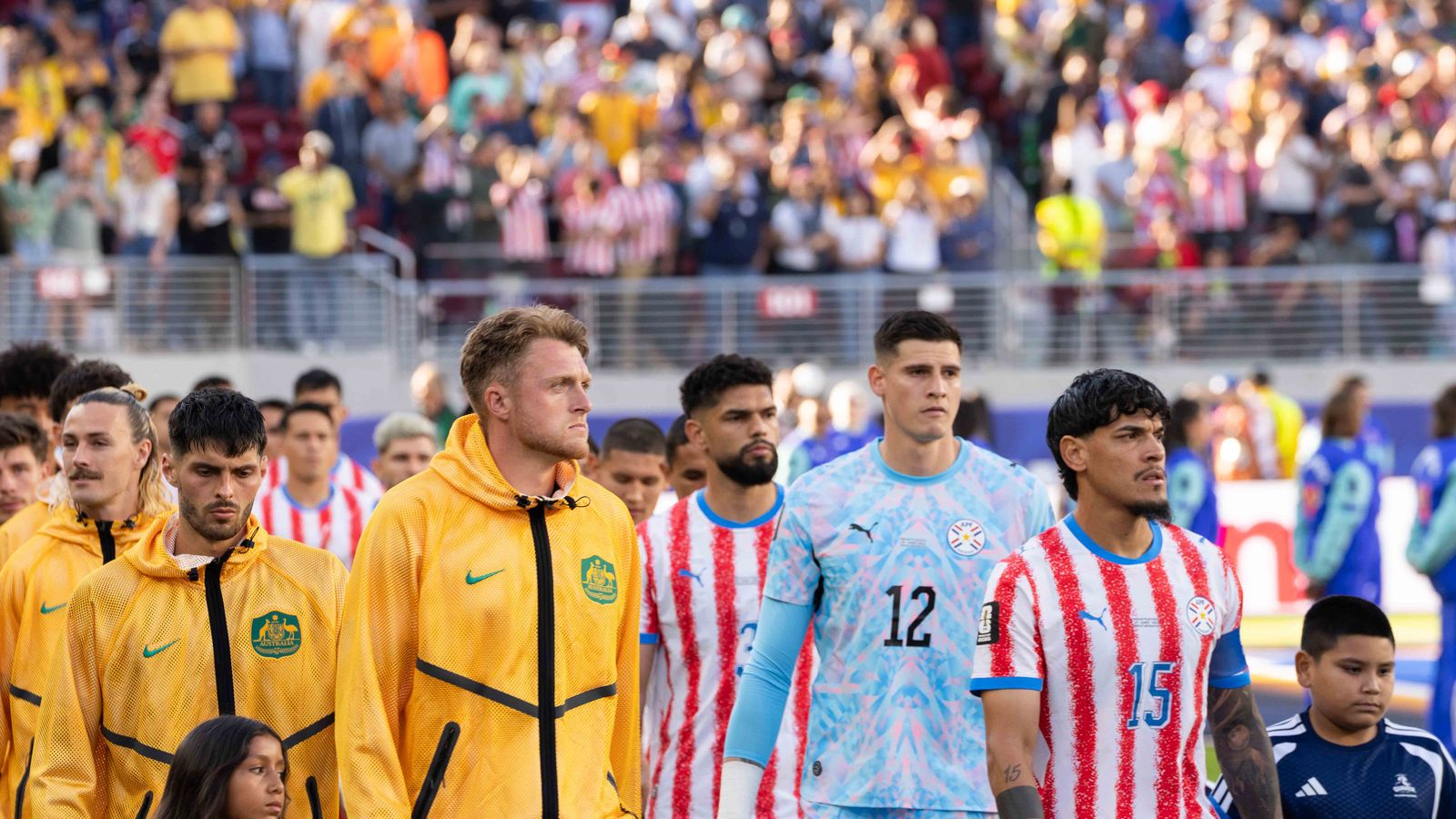 Teams Australia and Paraguay entering the field at FIFA World Cup 2026