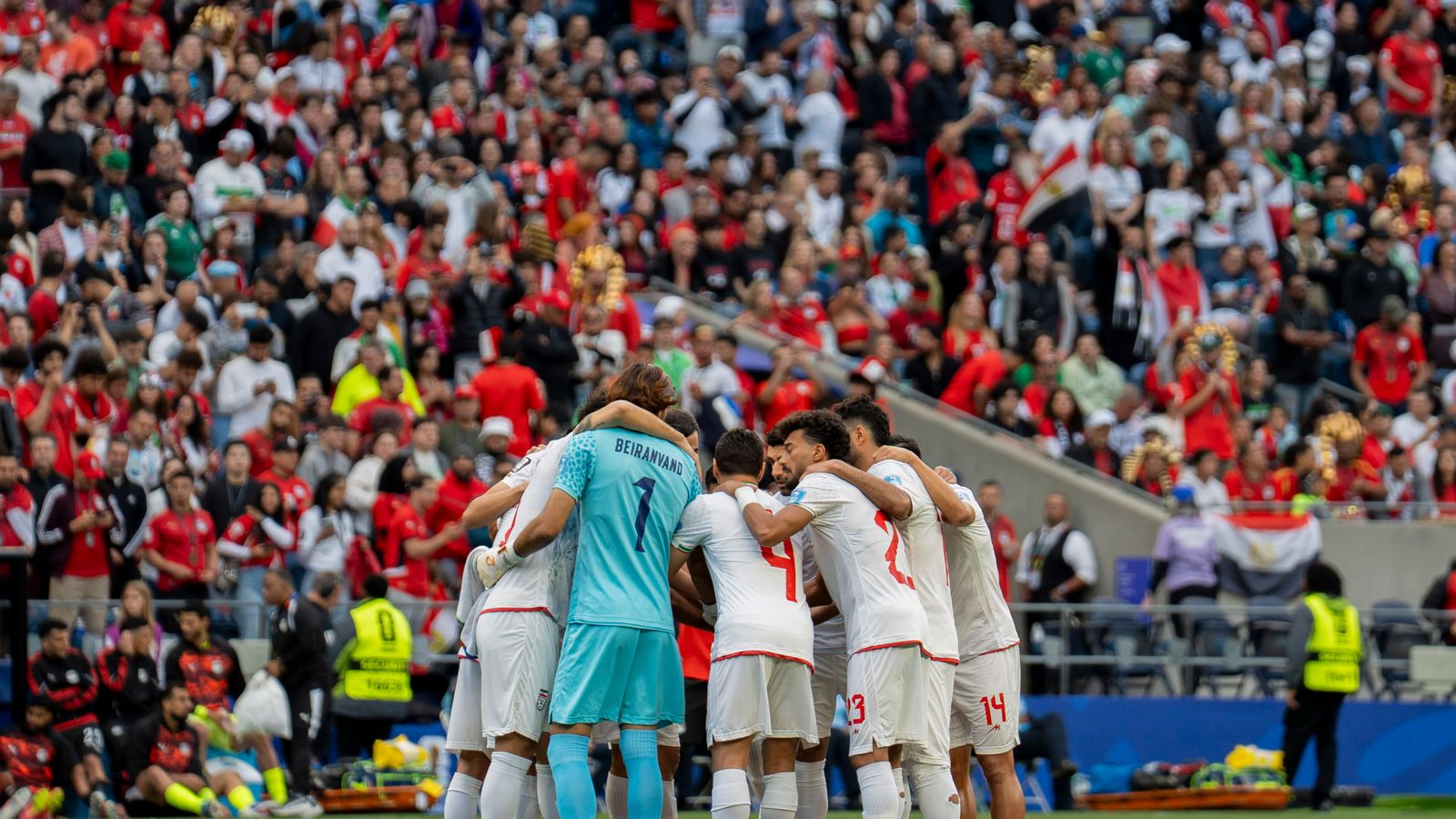 Iran team huddle before World Cup match against Egypt