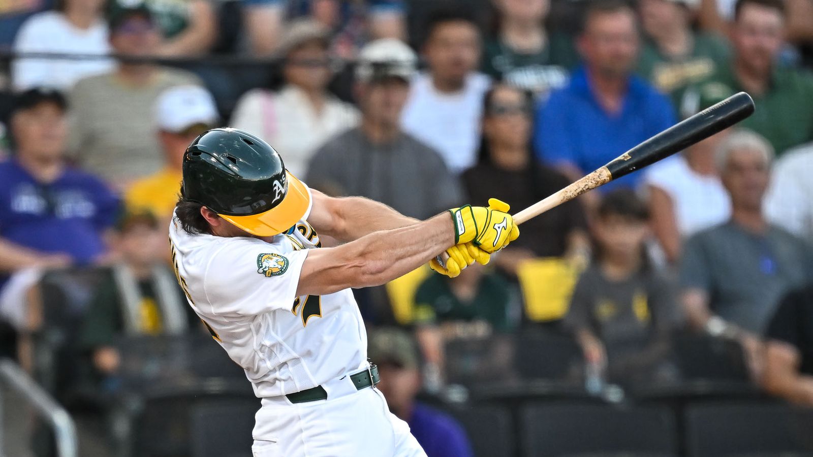 Athletics player secures a base hit.