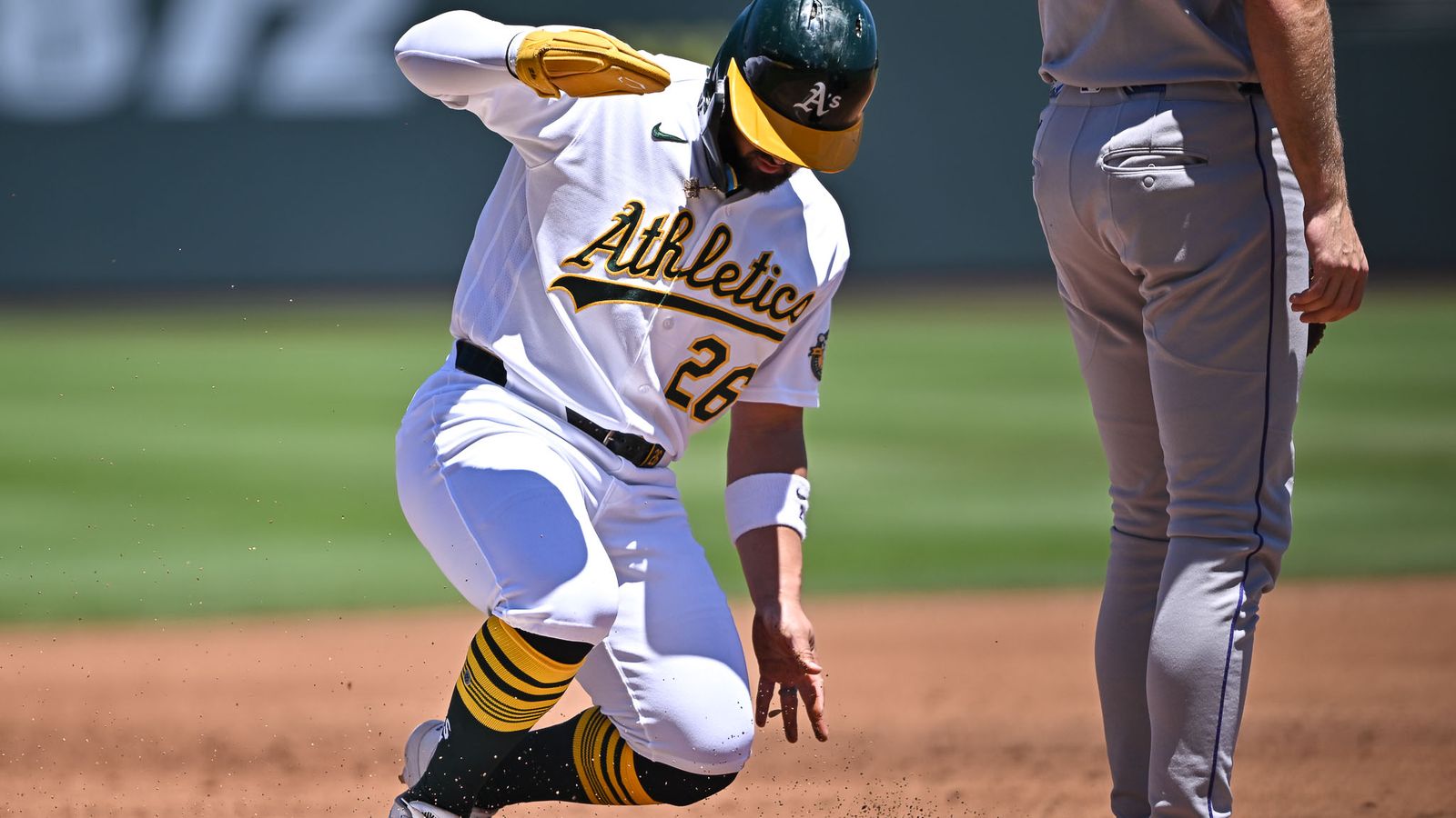 Carlos Cortes makes a safe run to third base.