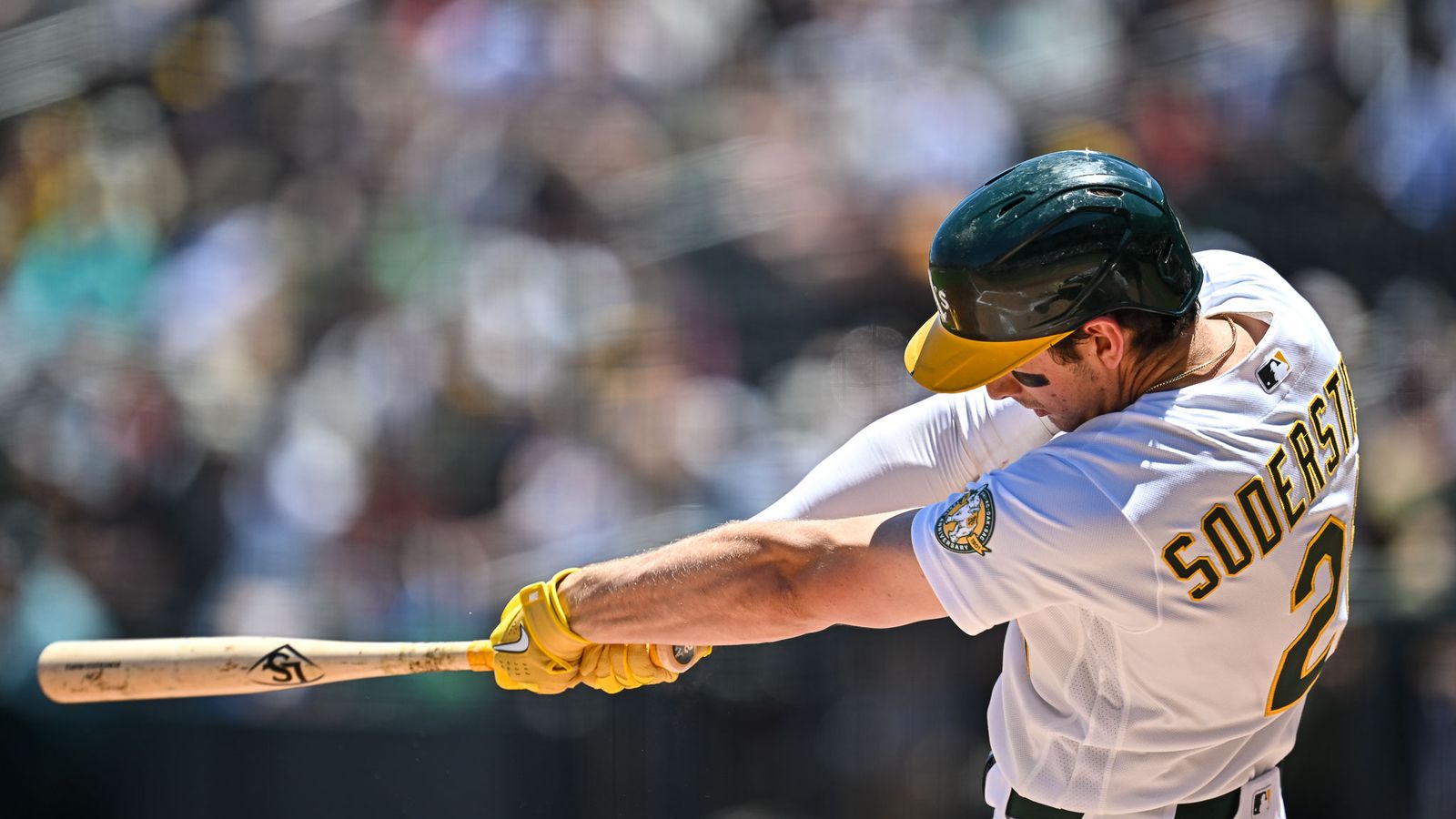 Athletics' left fielder scores with two runs and hits.