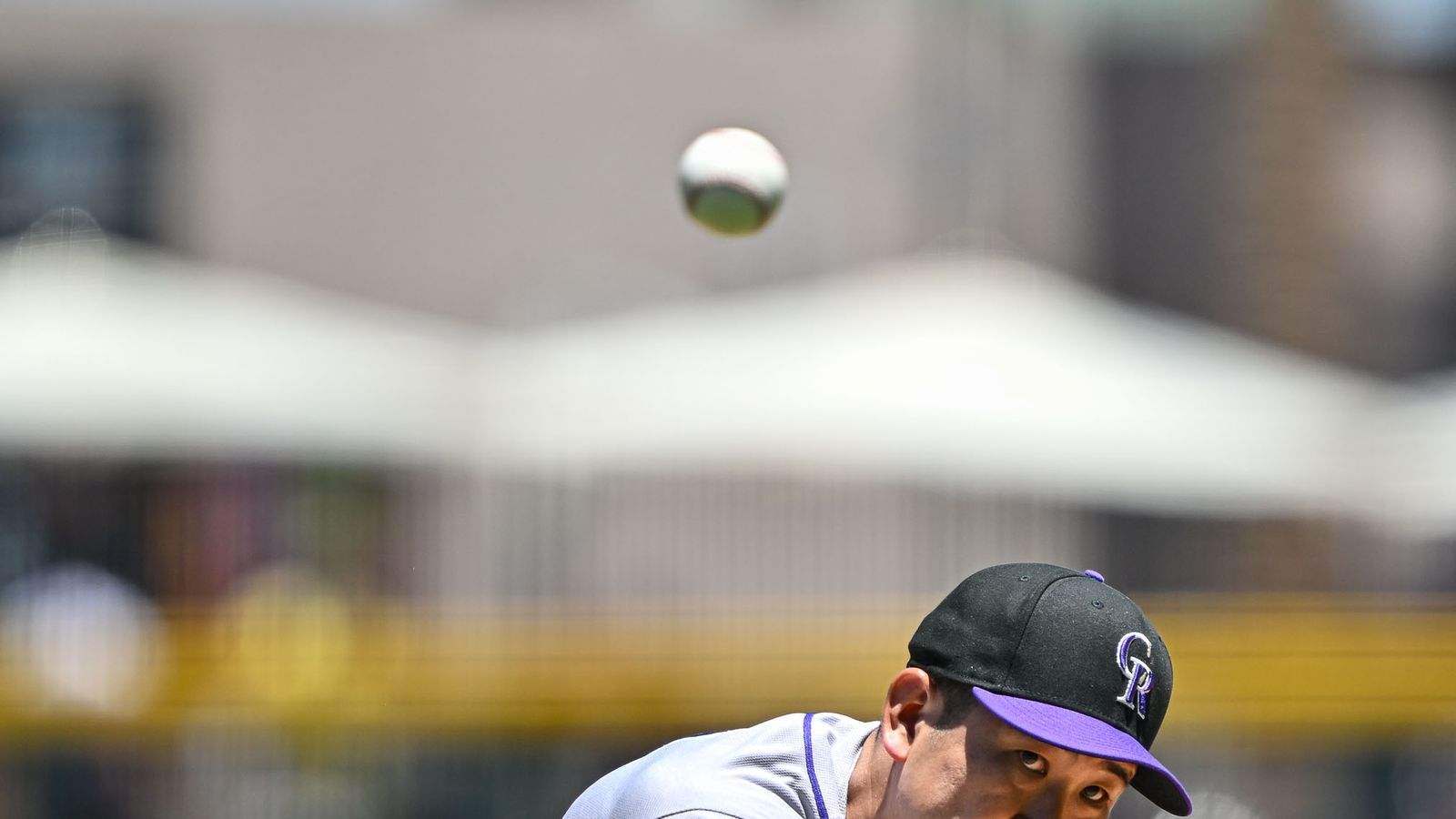 Tomoyuki Sugano pitches in a high-stakes MLB game.