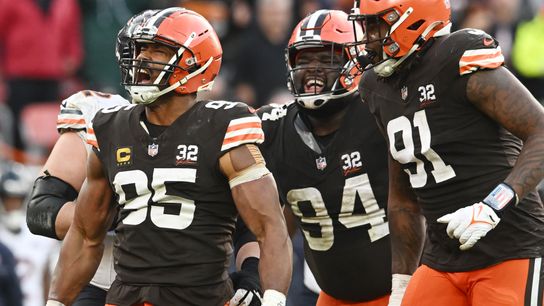 Garrett and team celebrate a tackle against the Bears