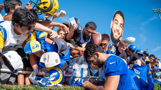 Puka Nacua signing autographs at Rams Training Camp