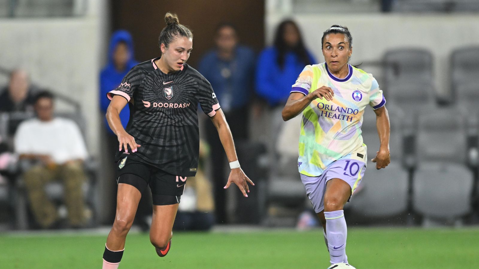 Marta dribbles past defenders in a tense match at BMO Stadium