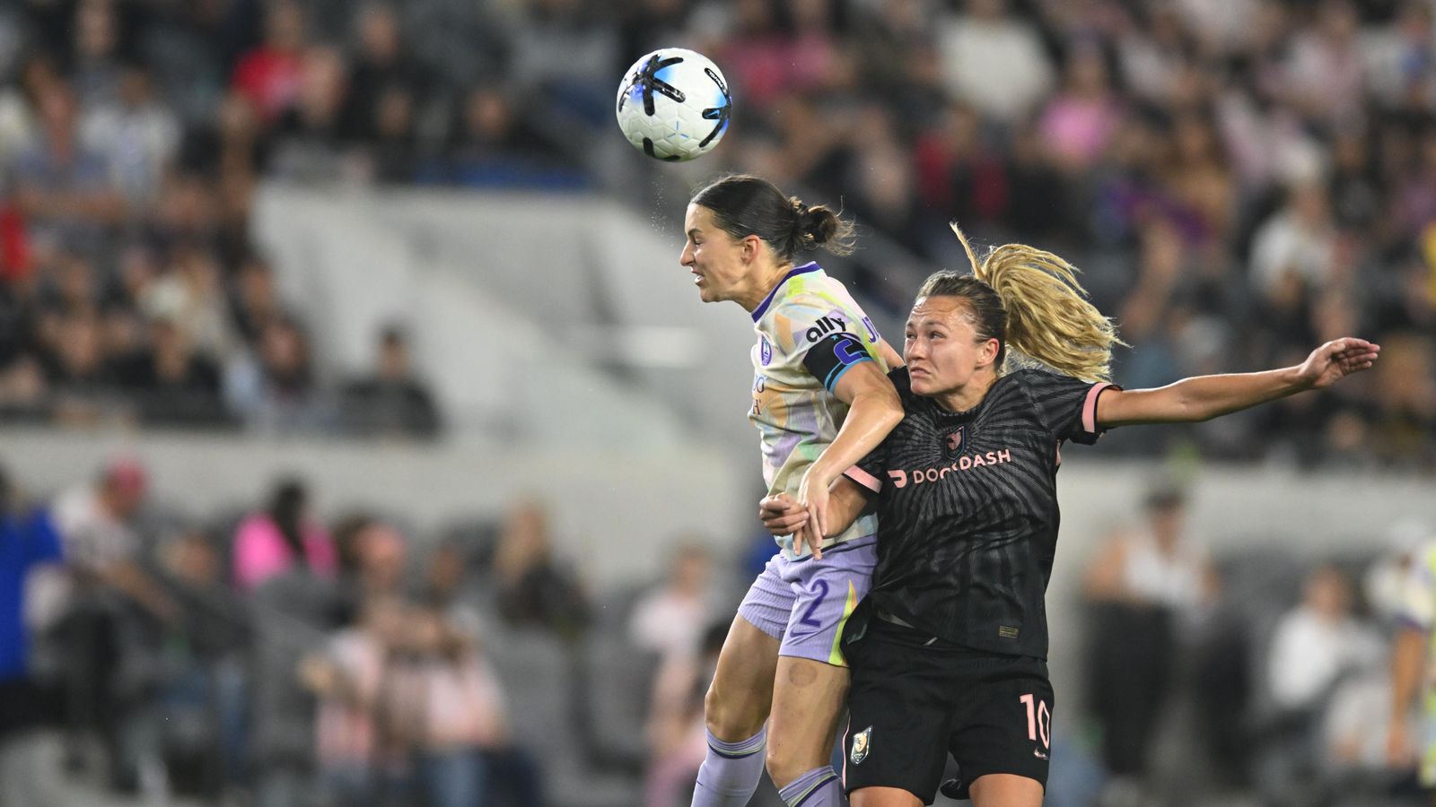 Haley McCutcheon heads the ball in a strategic play