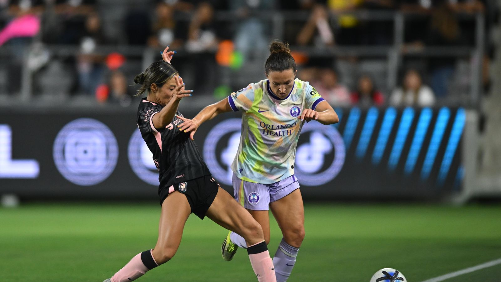 Jun Endo clears the ball under pressure