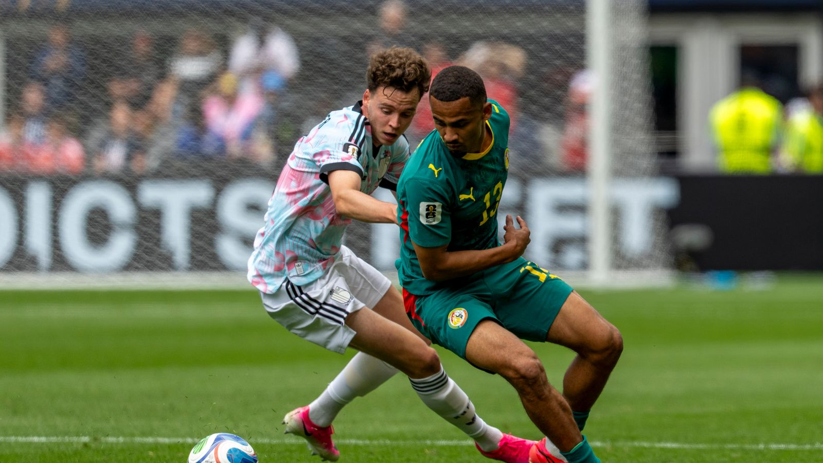 Iliman Ndiaye evades a defender in World Cup action