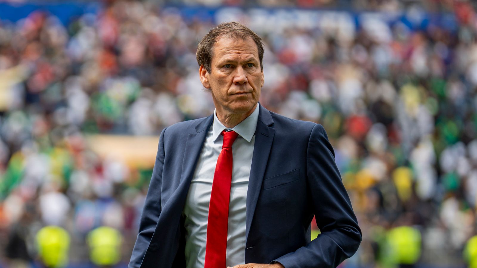 Coach Rudi Garcia heads to the locker room after the game