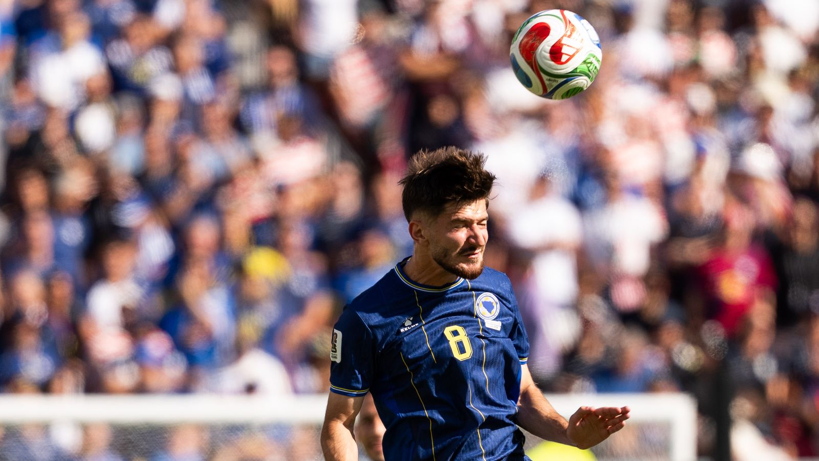 Armin Gigovic heads the ball in the FIFA World Cup 2026
