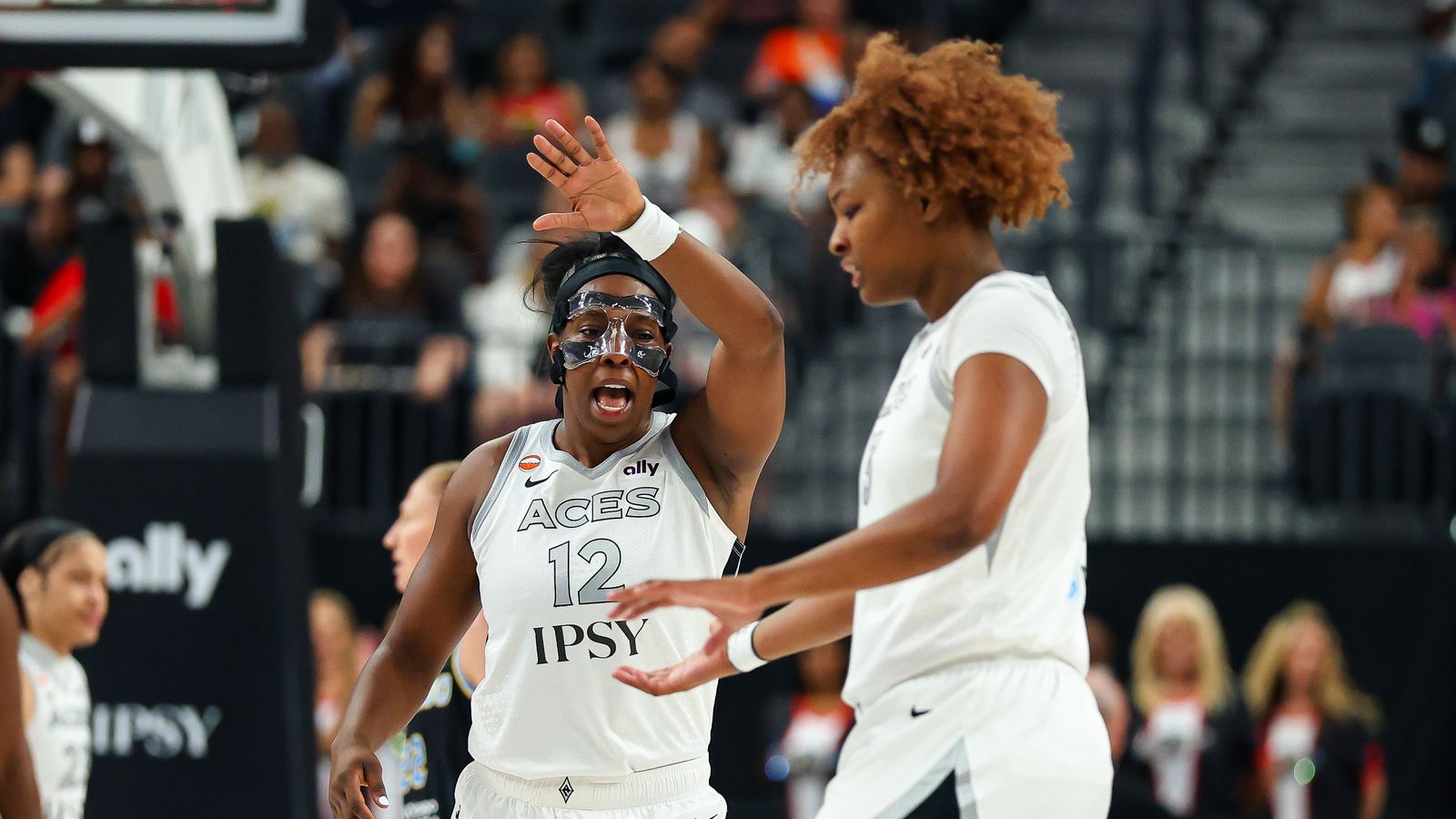 Chelsea Gray and Nalyssa Smith celebrate a basket.