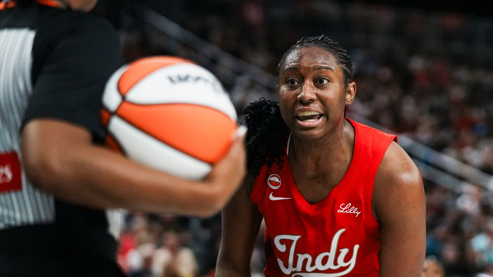Aliyah Boston disputes a call in a game against the Aces