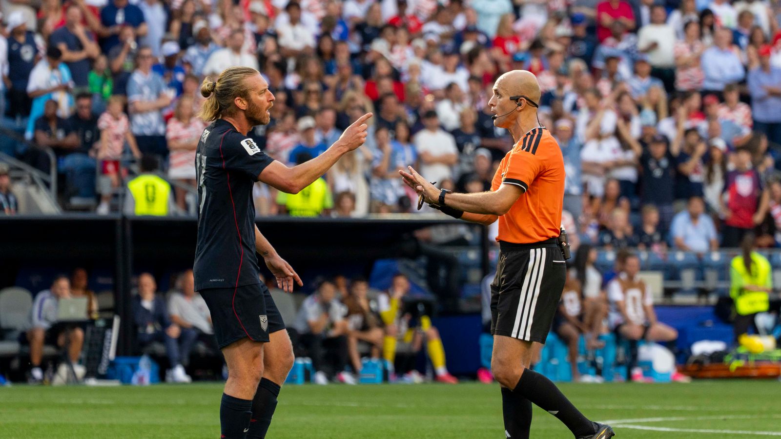 Tim Ream disputes with the referee in the World Cup match against Belgium.