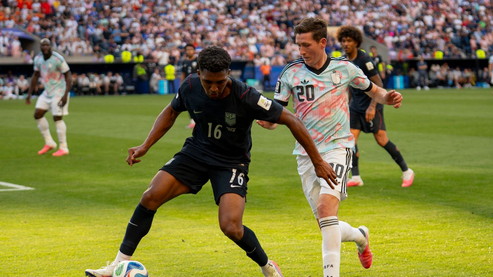 Alex Freeman regains possession in the World Cup match against Belgium.