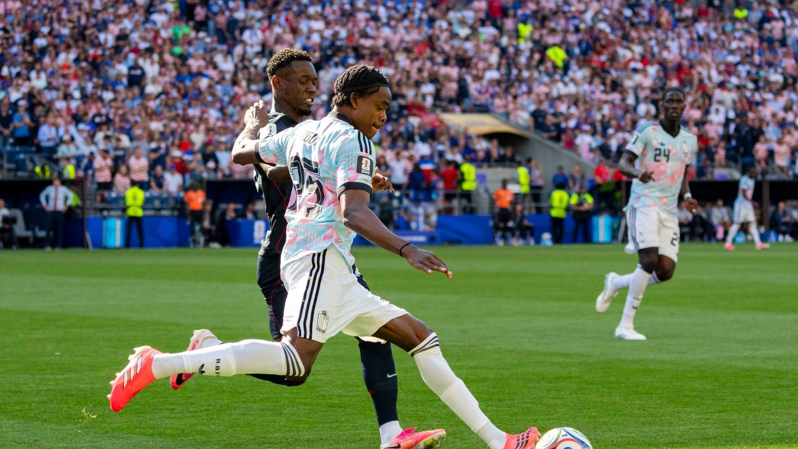 Nathan Ngoy clears the ball in the World Cup match against the US.
