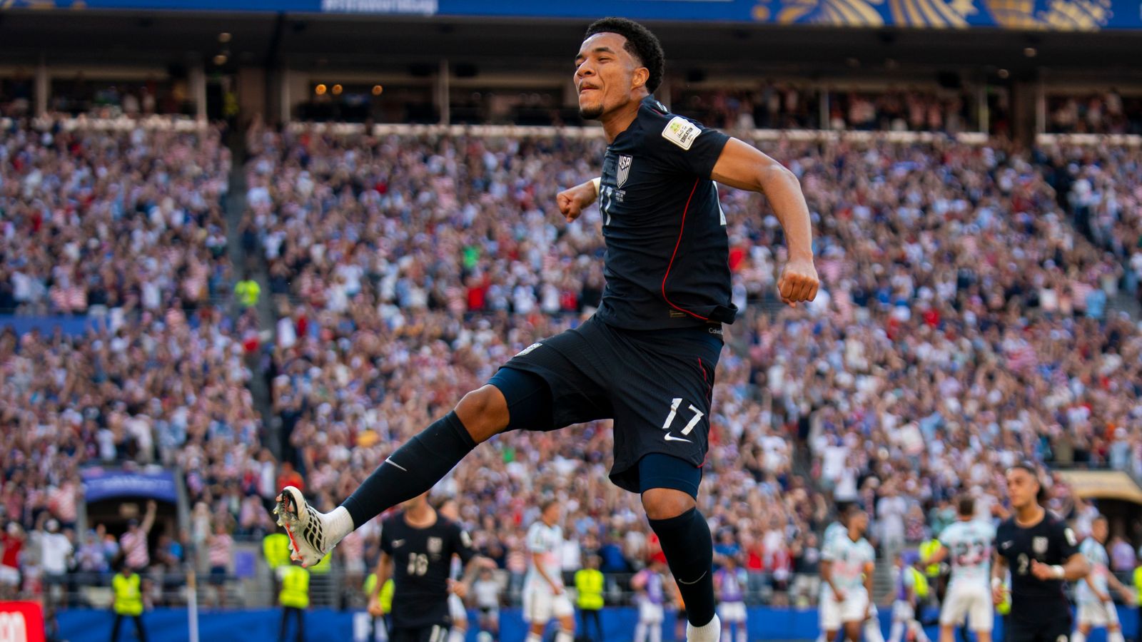 Malik Tillman celebrates his goal in the World Cup match against Belgium.