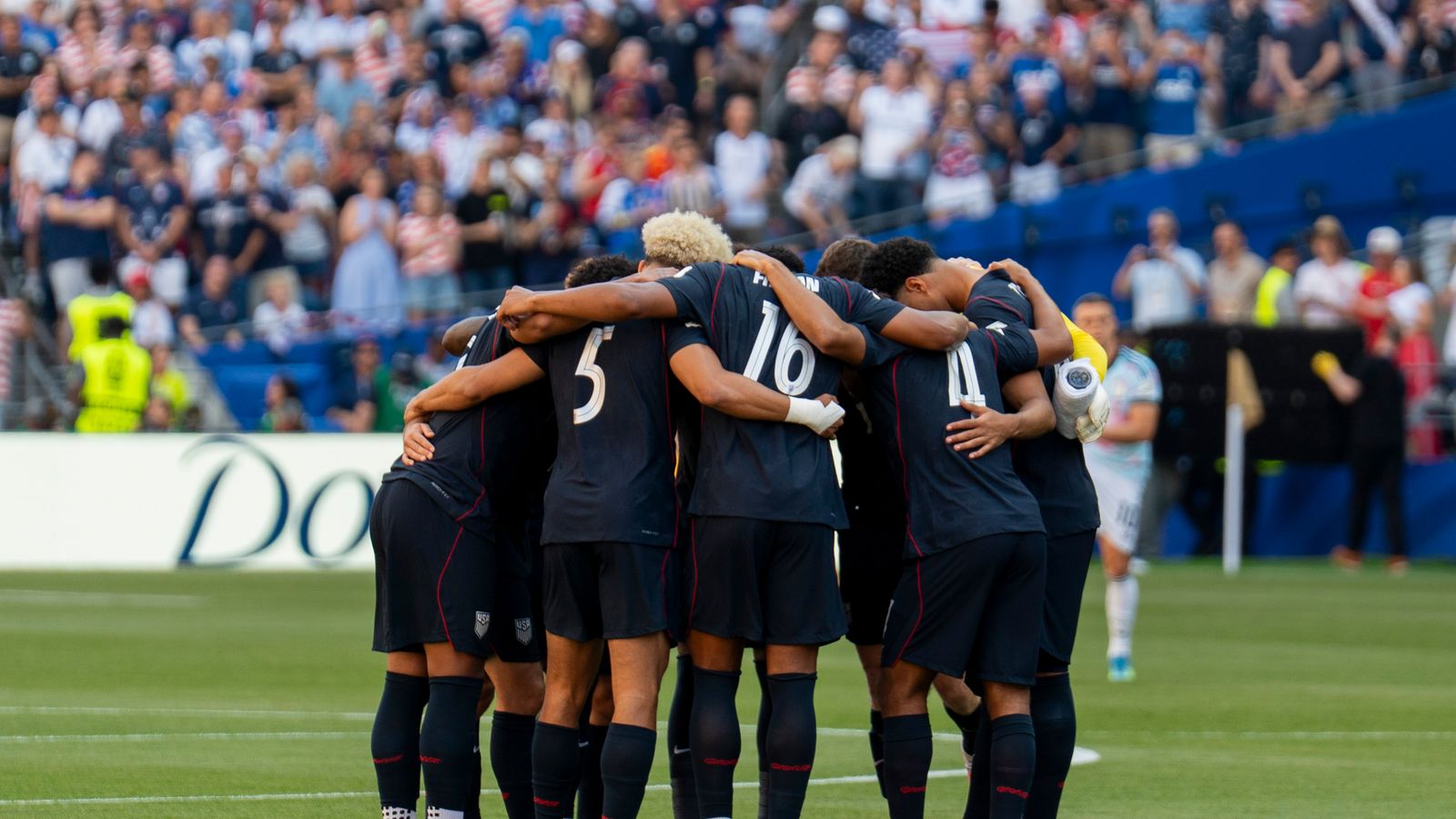 US team huddles before their World Cup match against Belgium in Seattle.
