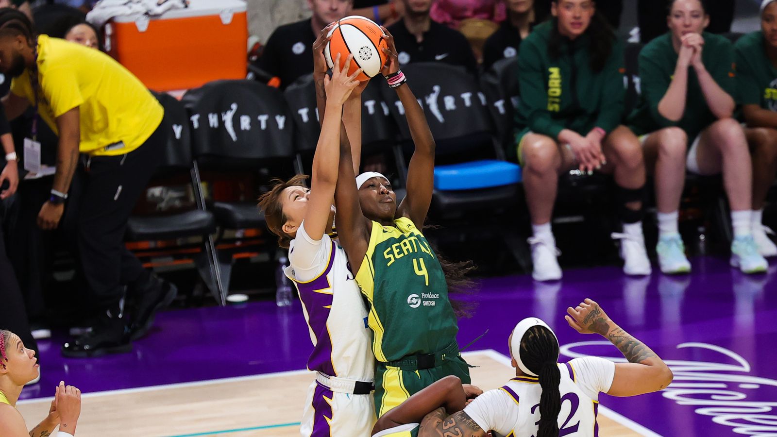 Jihyun Park and Flau'jae Johnson battle for a rebound.