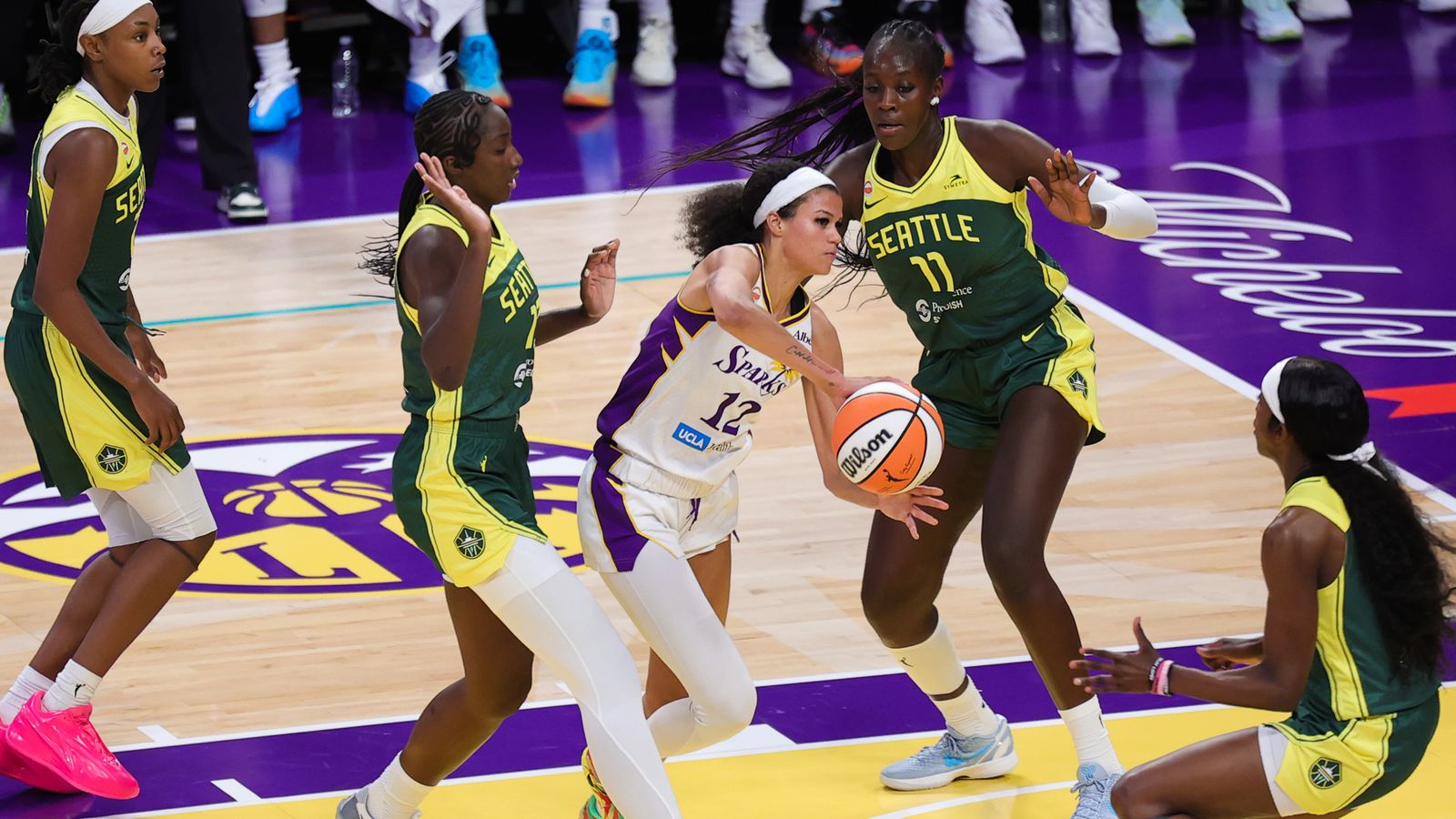 Rae Burrell passes the ball in a game against Seattle Storm.