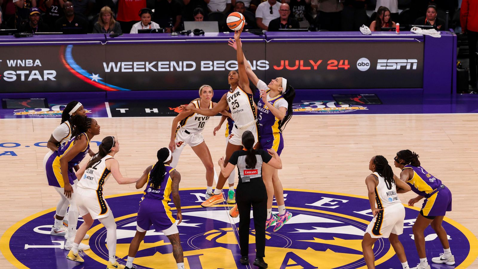 Billings and Hamby compete for the tip-off in Los Angeles
