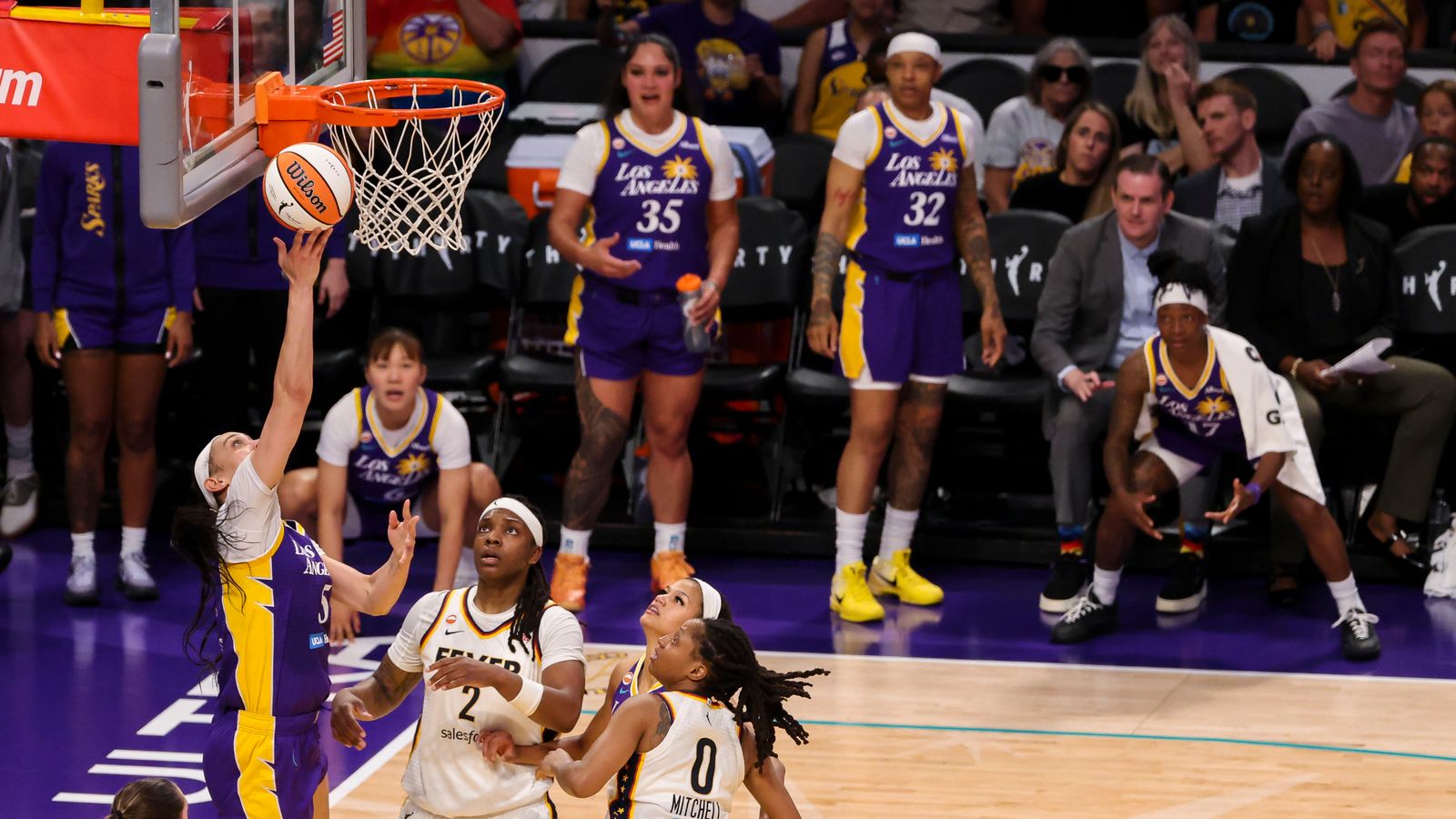 Dearica Hamby scores with the Sparks bench watching